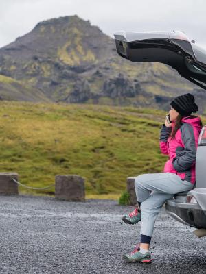 Car Rental in Iceland Car rental in Iceland with a person and a picturesque landscape in the background