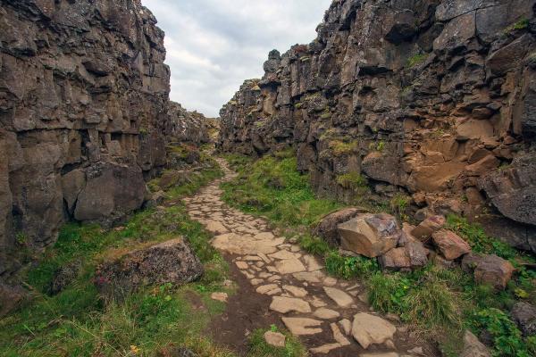 a stone path going through a rocky landscape .