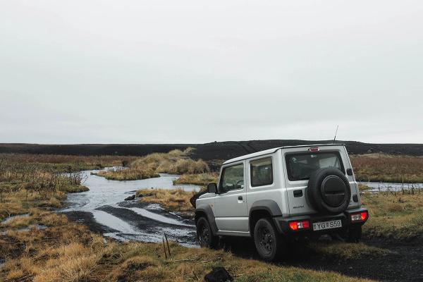 Embark on the ultimate off-road adventure in Iceland with our durable Suzuki Jimny rental. Suzuki Jimny rental car traversing an F road in the Icelandic wilderness.