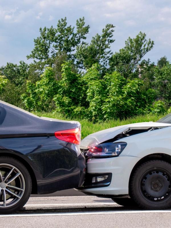 A car collision Road traffic accident. Two passenger cars collided on the road. Minor damage without injured people