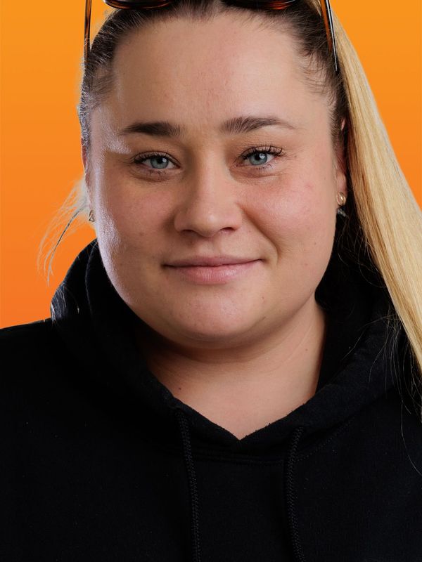 a woman wearing sunglasses and a black hoodie with the letter g on it