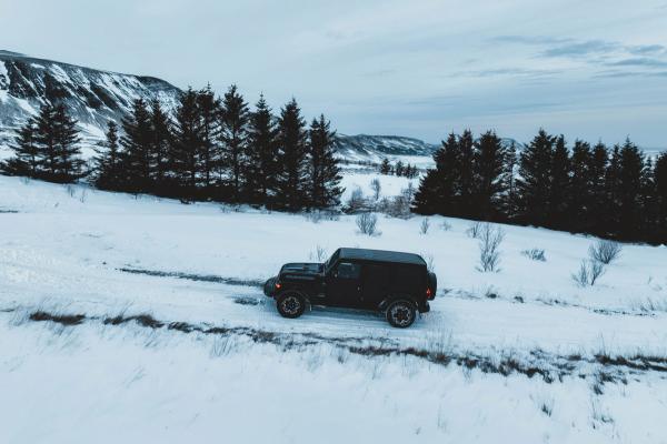 4x4 car and bad weather in Iceland Black 4x4 in the cold landscapes of Iceland where the snow is predominant