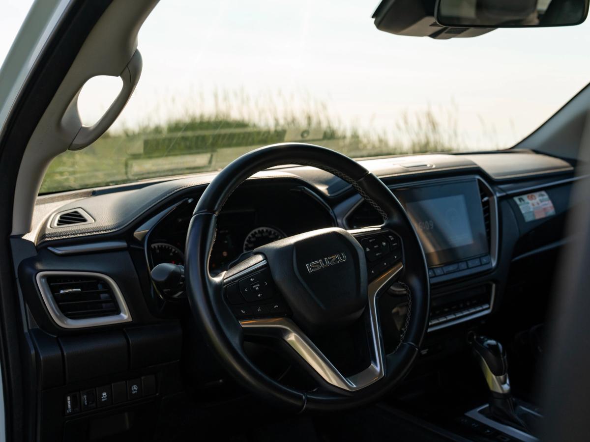 Dashboard And Steering Wheel Driver's dashboard with steering wheel, touchscreen display and centre console gear selector