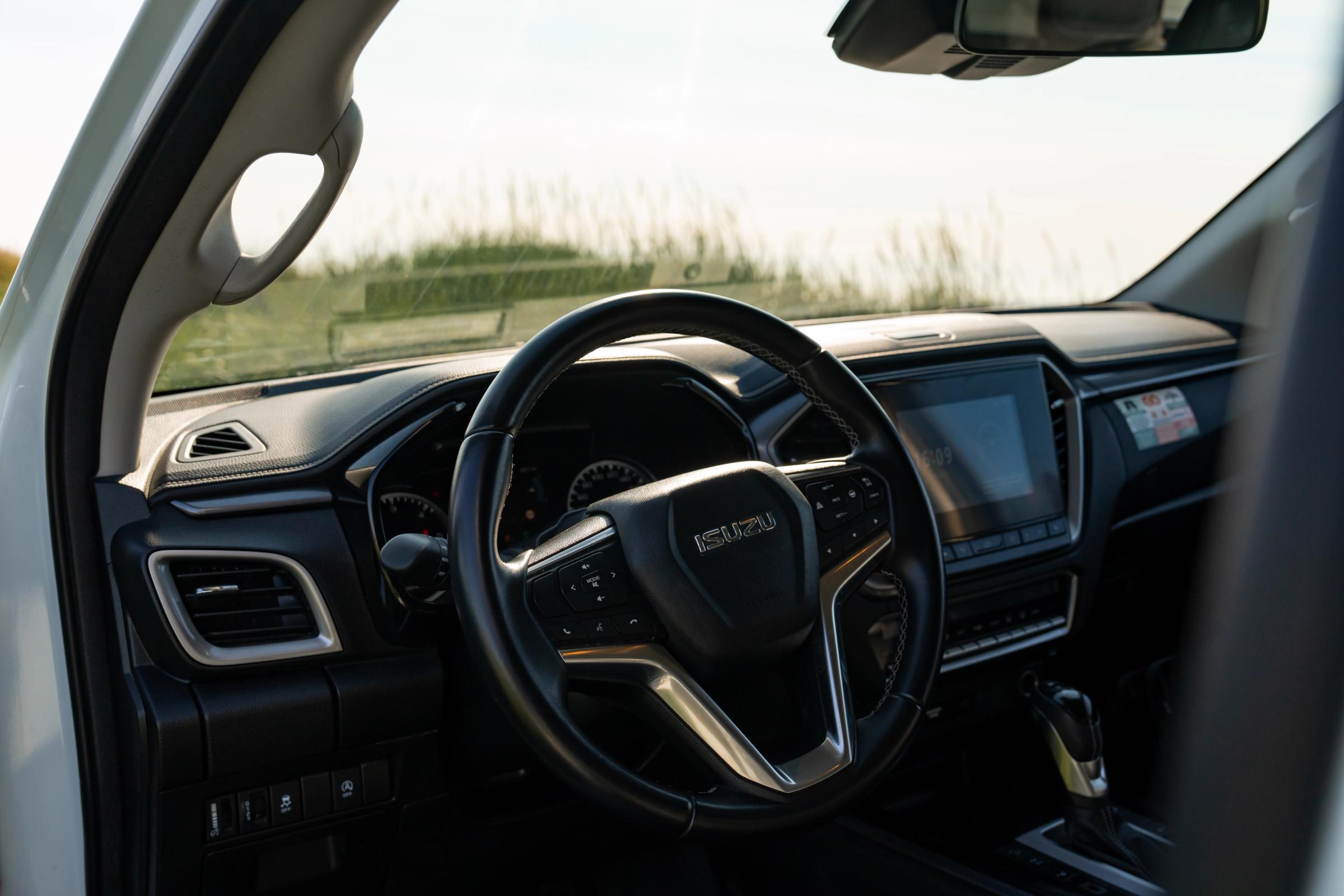 Dashboard And Steering Wheel Driver's dashboard with steering wheel, touchscreen display and centre console gear selector