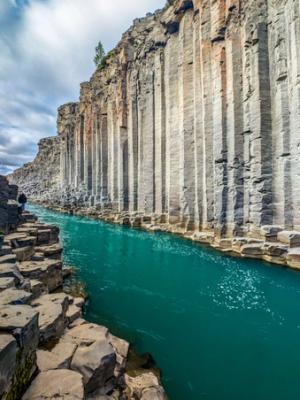 basalt canyon walls with a blue river