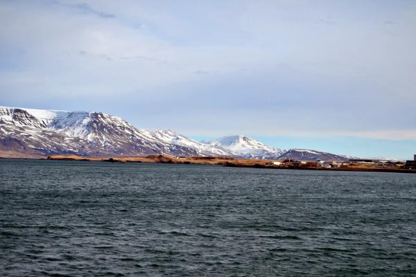 a large body of water with mountains in the background, Faxaflói Bay