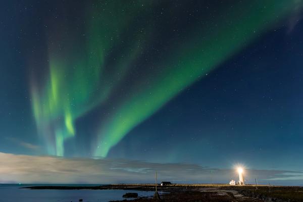 Lighthouse and Northern lights in the sky