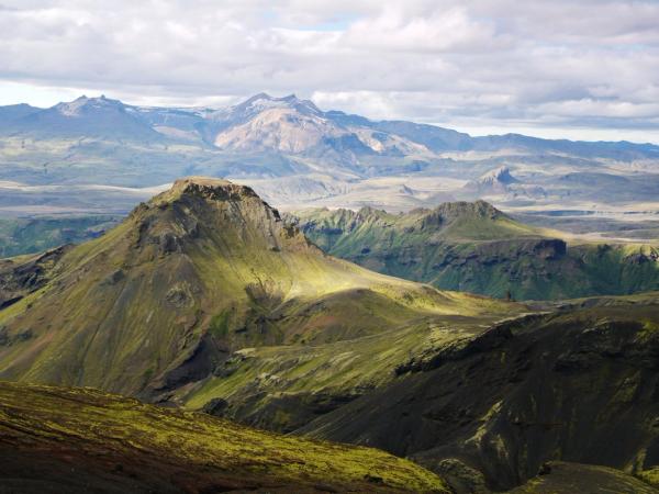a view of a mountain range with mountains in the background