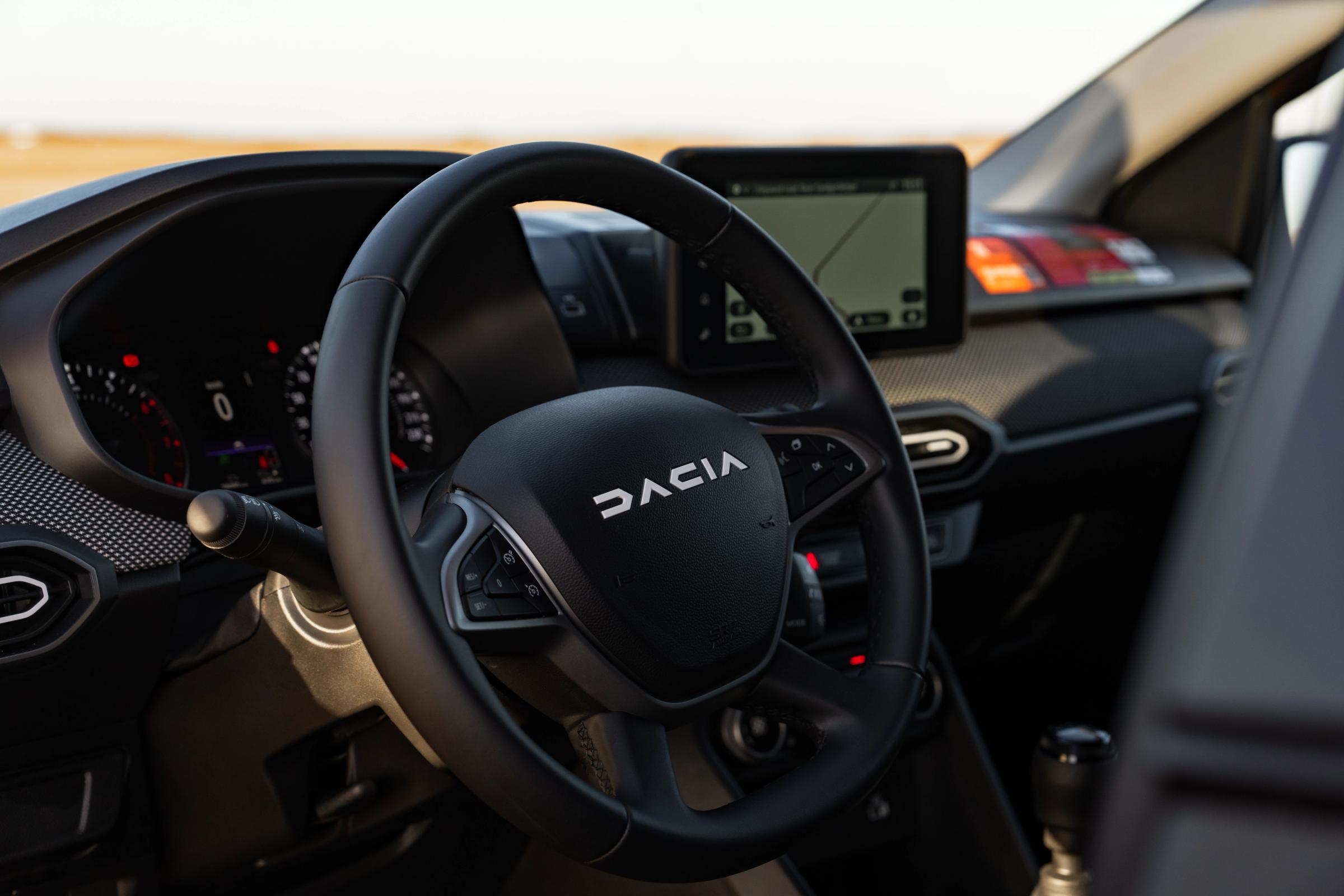 Dacia Jogger steering wheel close up with dashboard and infotainment screen visible