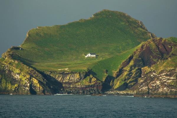An isolated house an a small green island