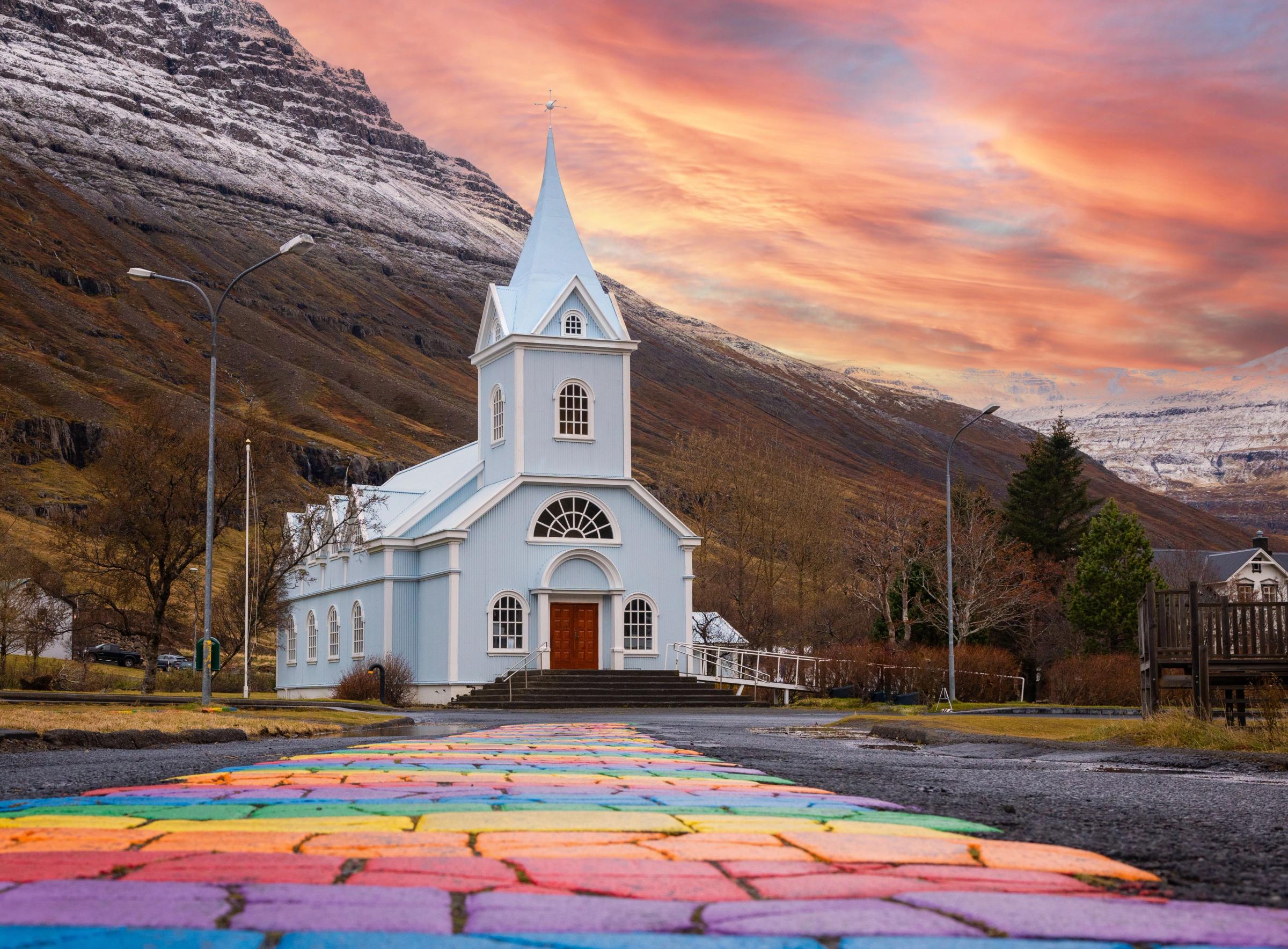 Rainbow Street leading to the Blue church in Seyðisfjörður