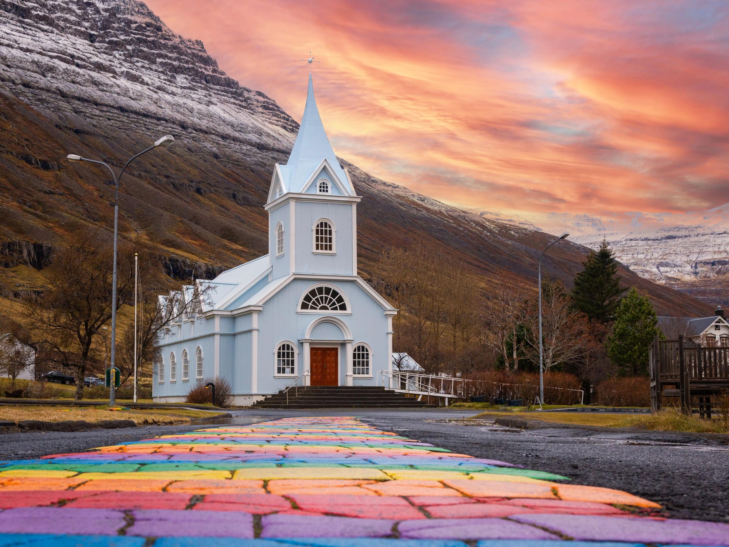 Rainbow Street leading to the Blue church in Seyðisfjörður