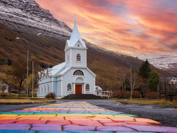 Rainbow Street leading to the Blue church in Seyðisfjörður