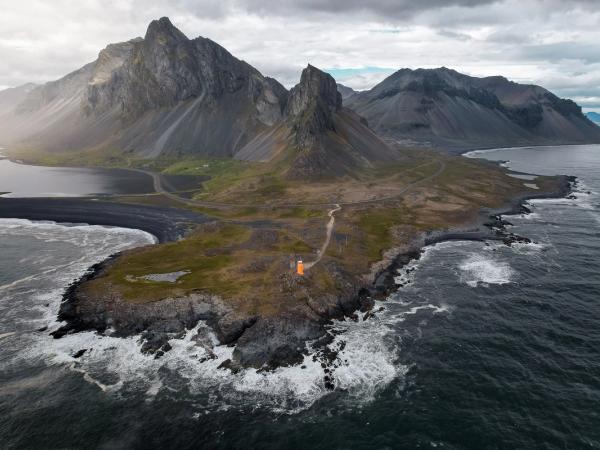 Aerial of Hvalnes Lighthouse in the middle of a Peninsula