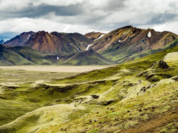there are mountains in the background and a valley in the foreground .