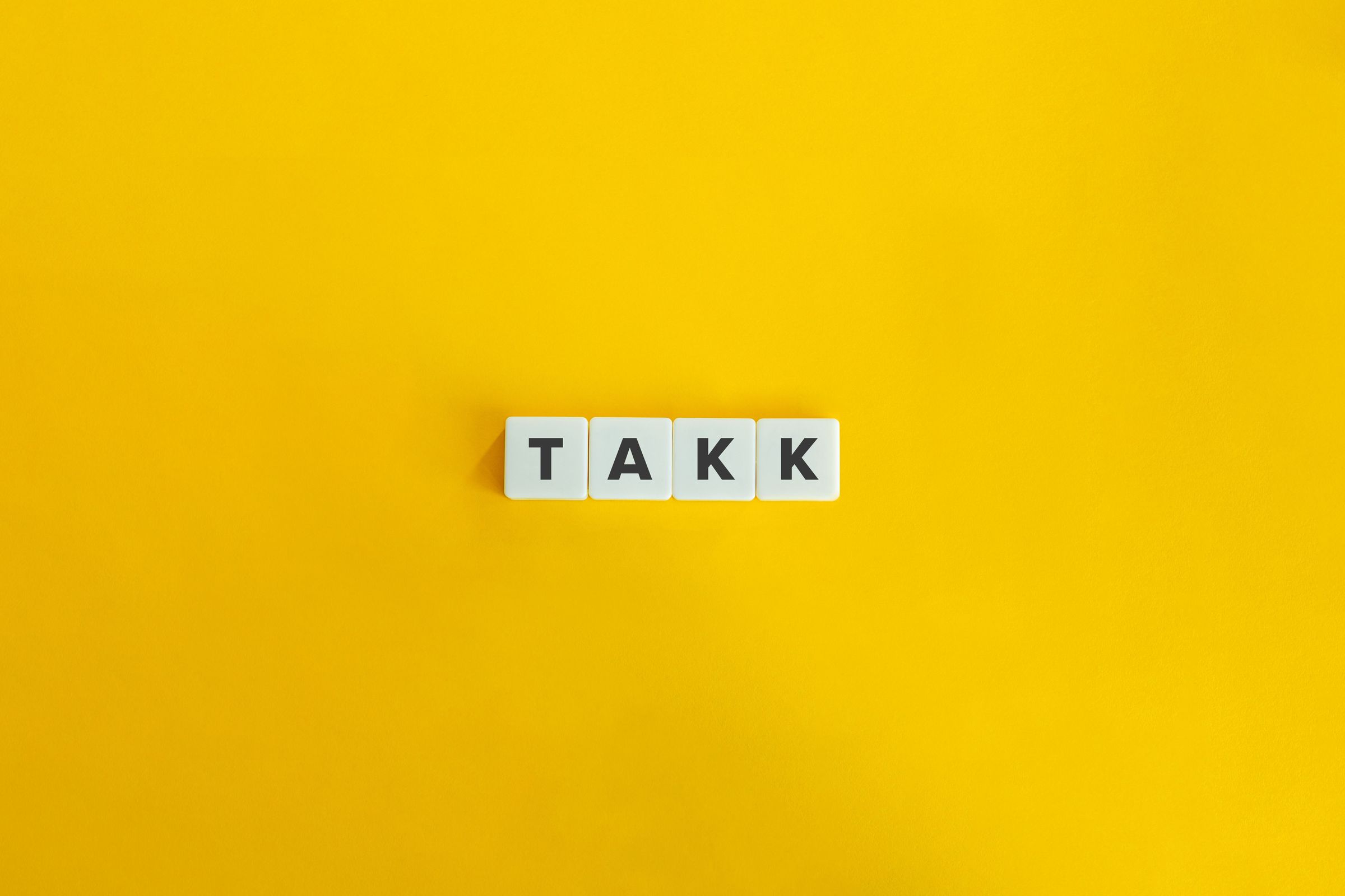 Letters making the word "takk"