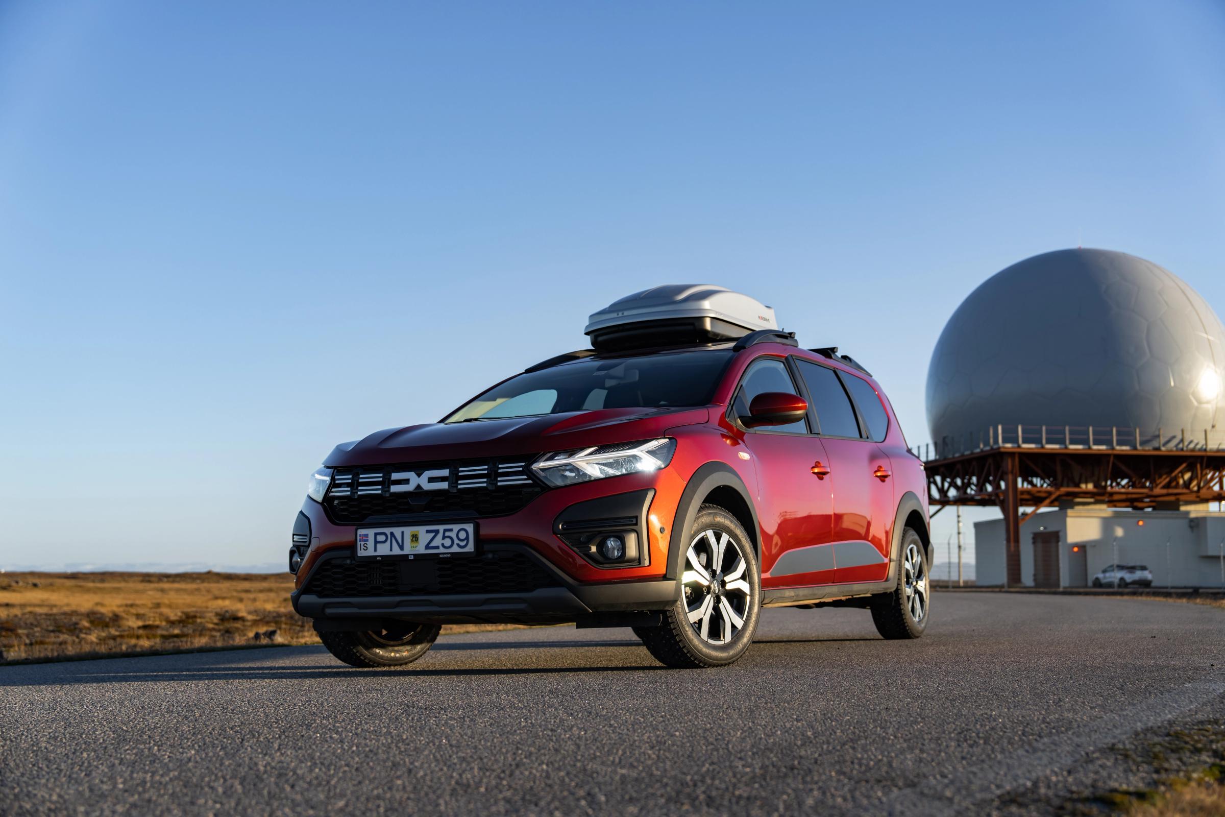 Dacia Jogger Iceland road trip vehicle with roof box parked on paved road