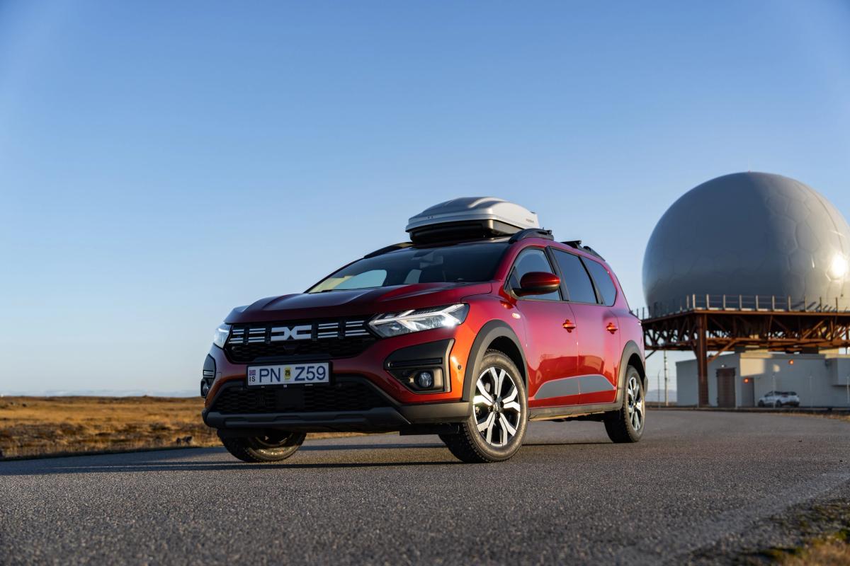 Dacia Jogger Iceland road trip vehicle with roof box parked on paved road