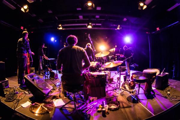 Band playing a concert at a bar