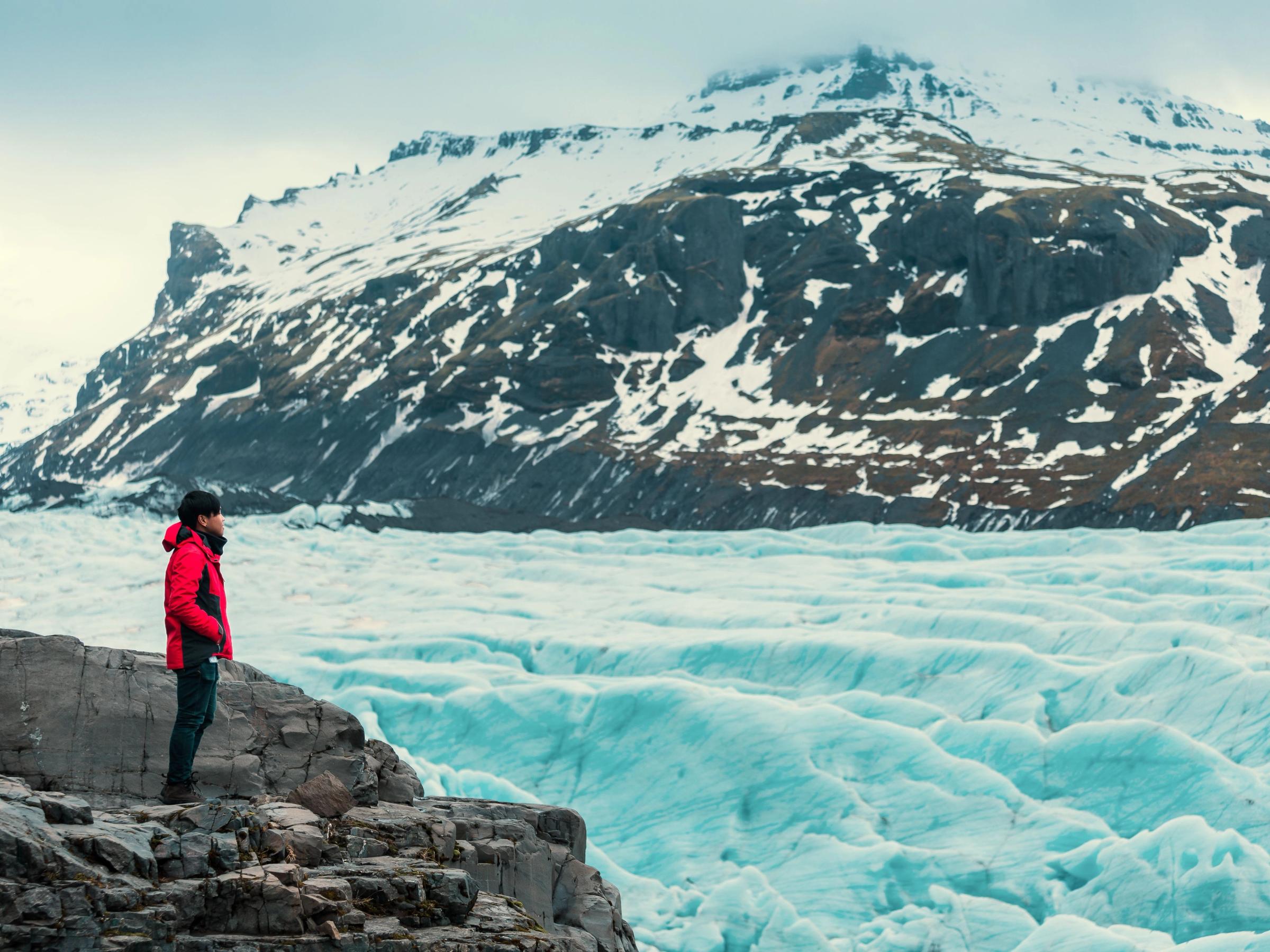 Girl admiring a glacier in Iceland
