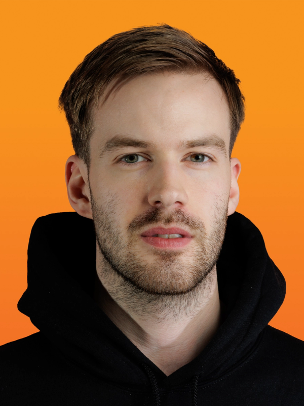 a man with a beard is wearing a black hoodie