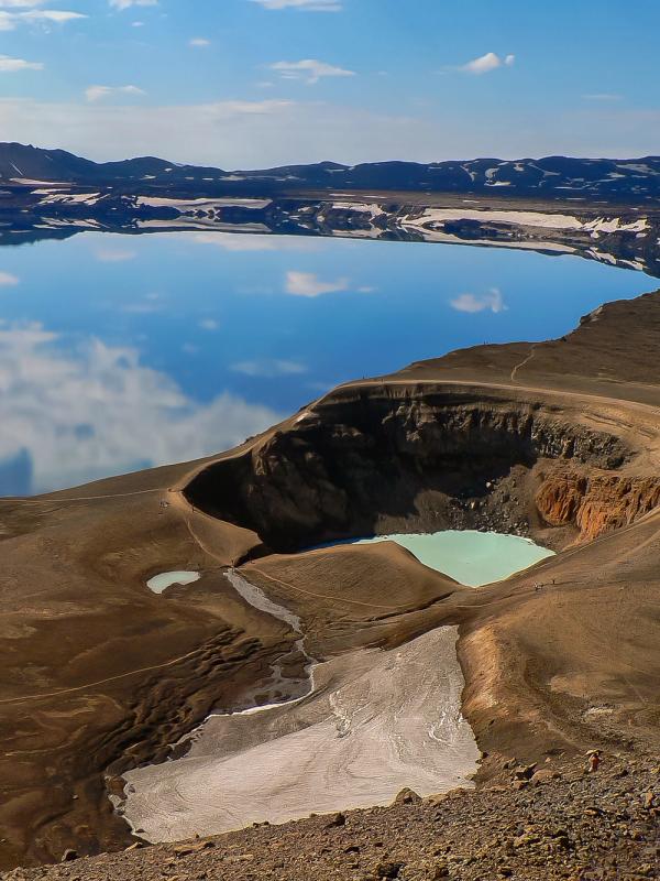 Aerial of a volcanic landscape with a crater and a lake