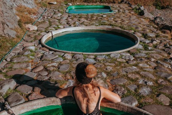 Girl inside one of the hot tubs at Hoffell