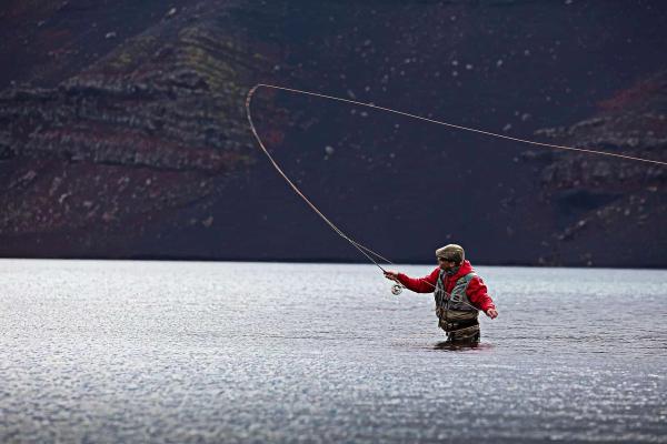 Volcano Fishing, Iceland Man fishing in the volcano, Iceland