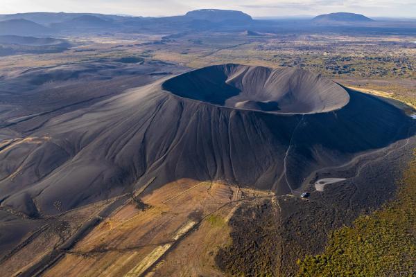 an aerial view of a volcano in the middle of a desert .