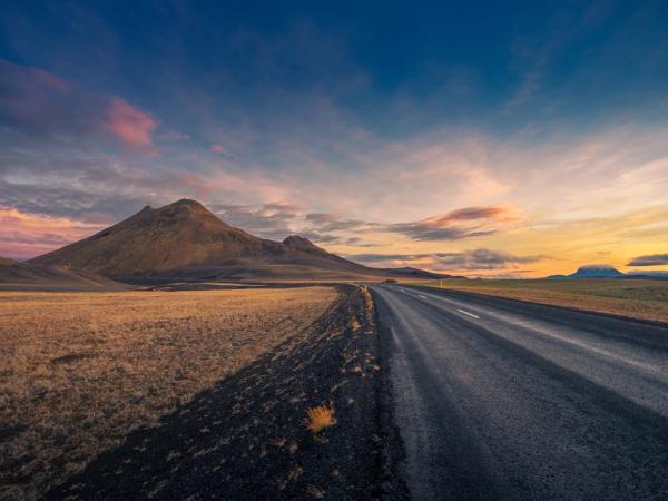 Road with a mountain during the twilight