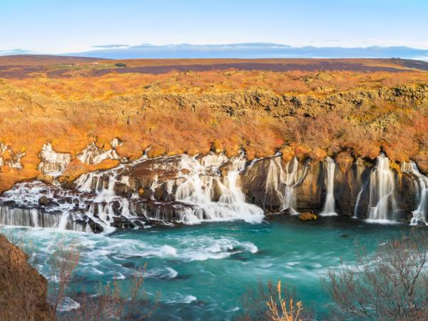Hraunfossar Waterfall from a far on a sunny day