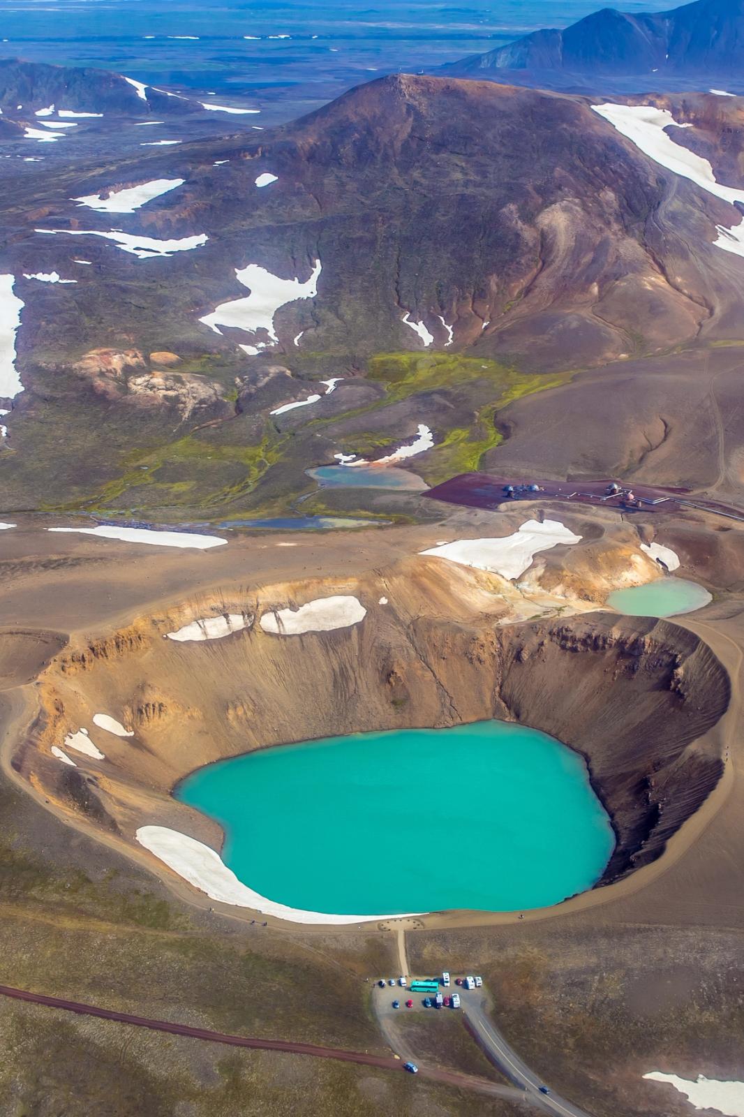 an aerial view of a volcano with two lakes in the middle at víti crater in iceland.