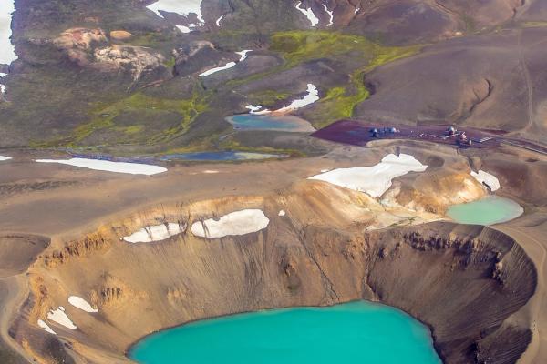 an aerial view of a volcano with two lakes in the middle at víti crater in iceland.