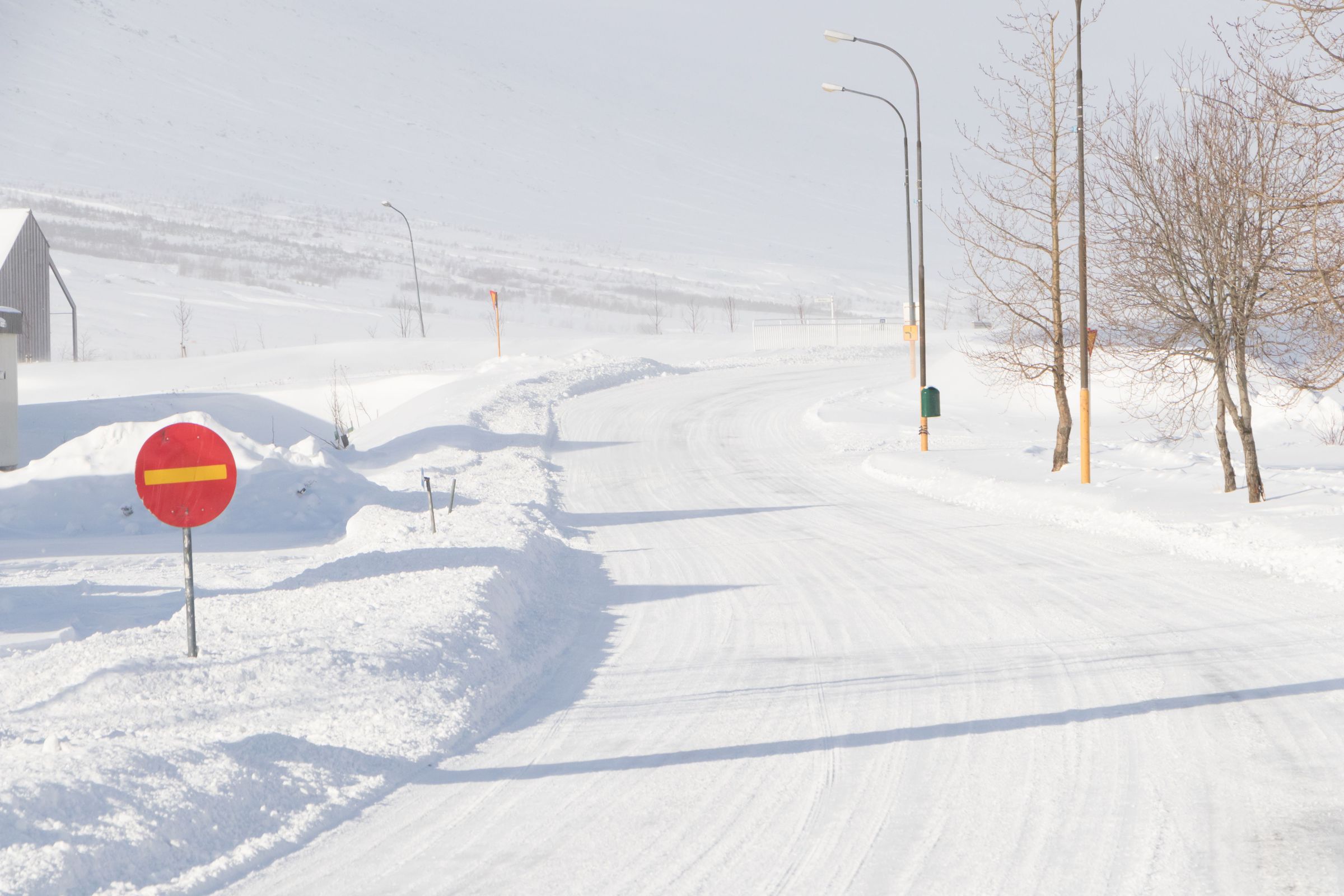 Snow road in Iceland Clear road covered in snow during winter in Iceland