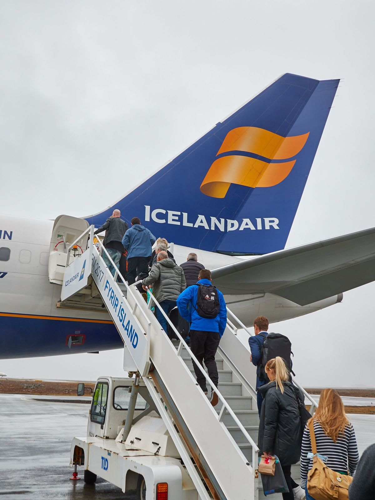 plane at Keflavik airport group of people boarding an Icelandic plane at Keflavik airport