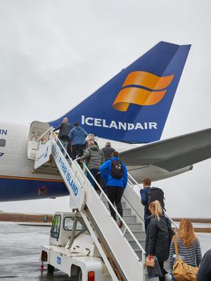 plane at Keflavik airport group of people boarding an Icelandic plane at Keflavik airport