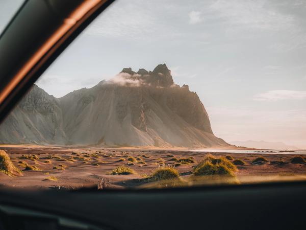 a view of a mountain through a car window