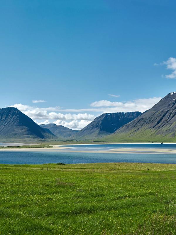 view of a lake with mountains in the background