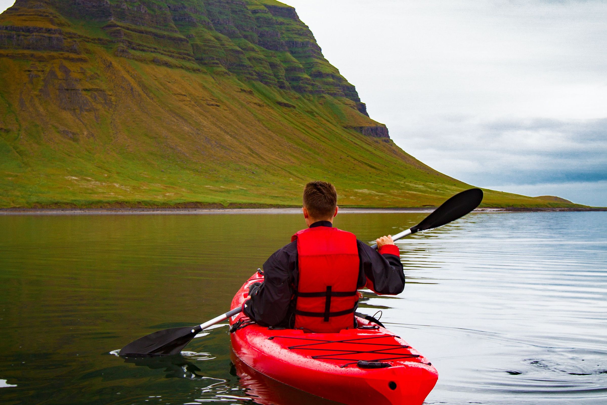 A man kayaking in Iceland