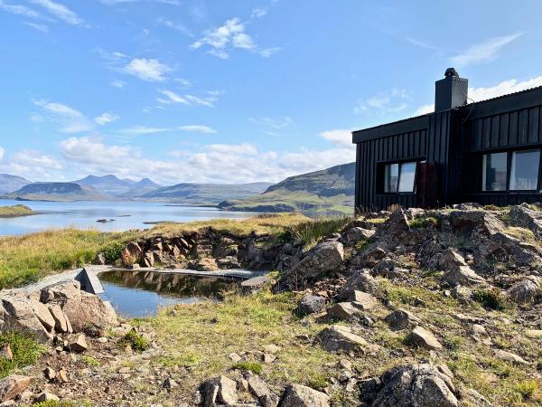 Accommodation at Hvammsvík Hot Springs with views to the fjord