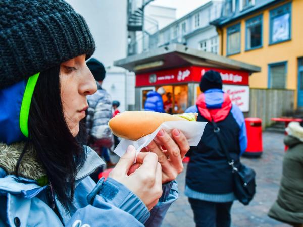 Girl about to eat an Icelandic hot dog