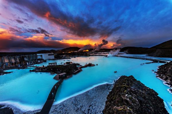Blue Lagoon with the sunset in the background .