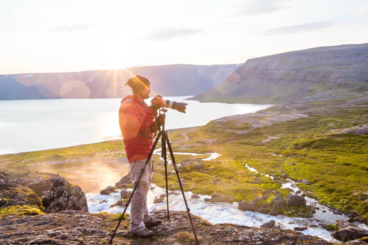 a photopgrapher taking pictures of Iceland's landscapes and its sunset