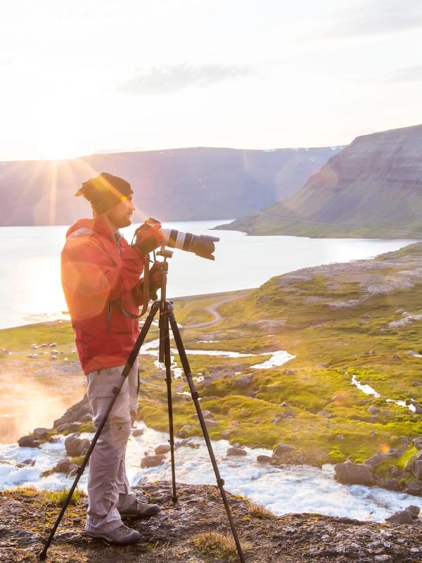 Photographer in the middle of Iceland's landscapes a photopgrapher taking pictures of Iceland's landscapes and its sunset