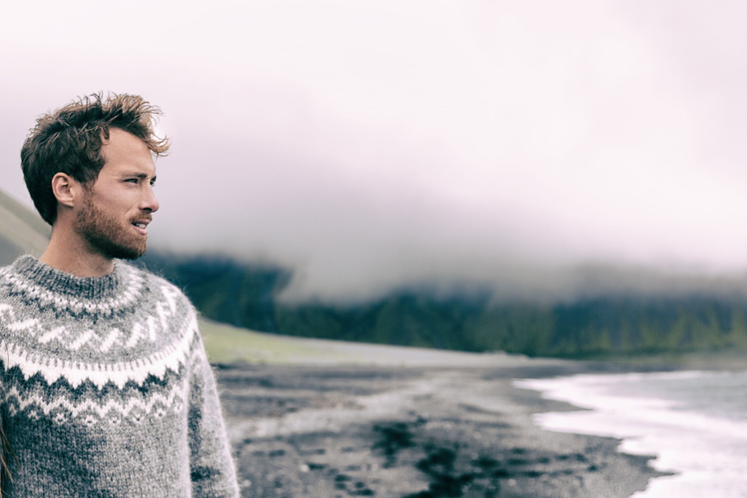 Couple in Iceland wearing merino wool sweaters