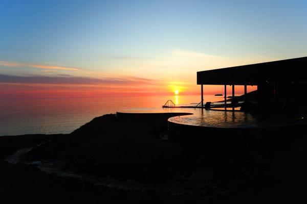 Hot springs overlooking the Fjord during the Midnight Sun