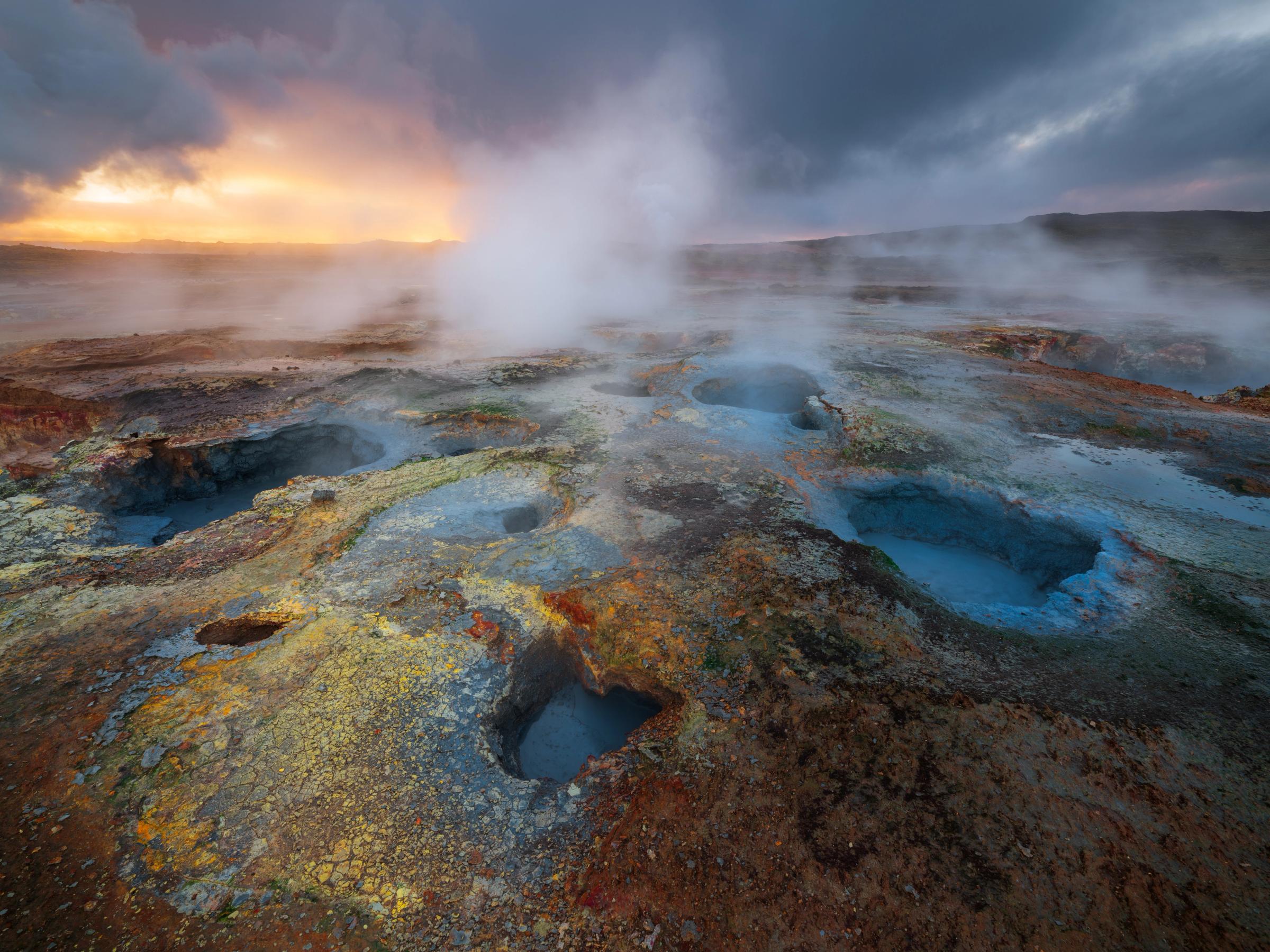 there is a lot of steam coming out of the ground .