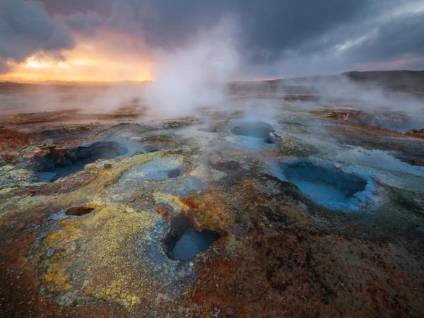 there is a lot of steam coming out of the ground .