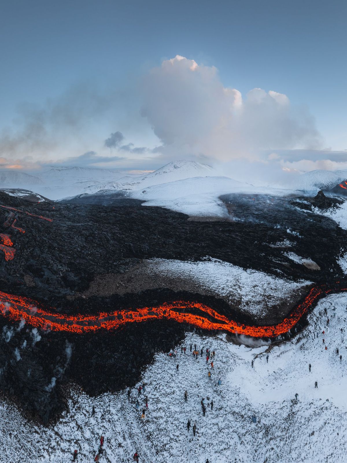 lava in Iceland Icelandic landscape of a field with a lot of smoke and lava from a volcano