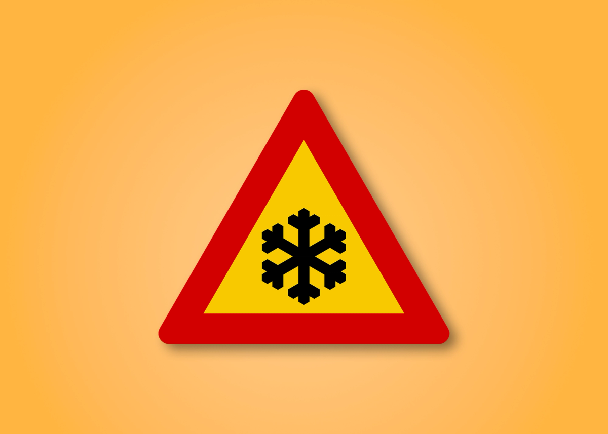 a yellow and red triangle with a snowflake on it